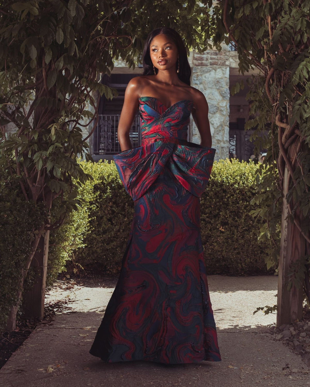 Multi Swirl Strapless Brocade Mermaid Gown With Bow Detail
