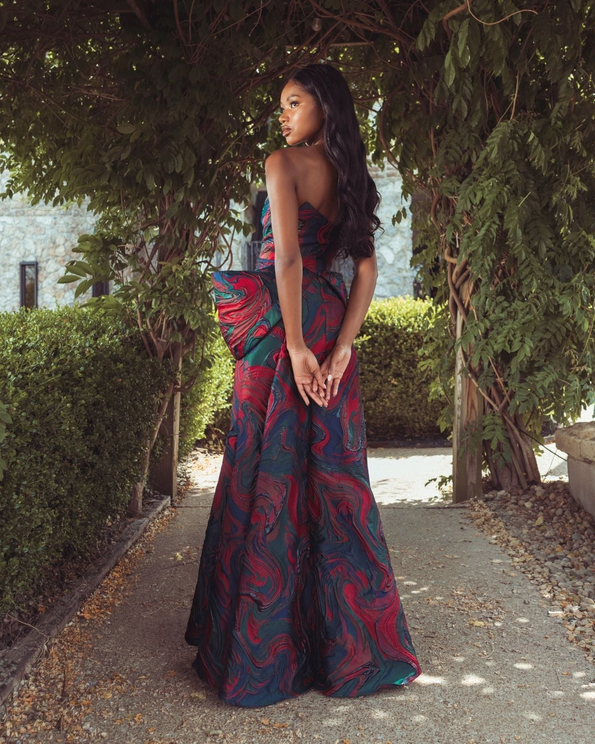 Multi Swirl Strapless Brocade Mermaid Gown With Bow Detail